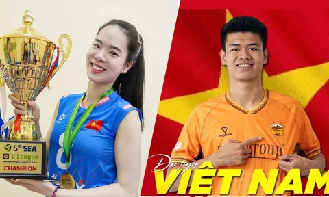 Hai tuyển thủ Lê Thanh Thúy và Đinh Quang Kiệt cầm cờ tại Lễ khai mạc ASIAD 20