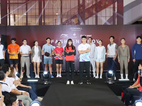 Vận động viên Huỳnh Thị Mỹ Tiên và Lê Quốc Khánh trình diễn thời trang tại Sport Fashion Show